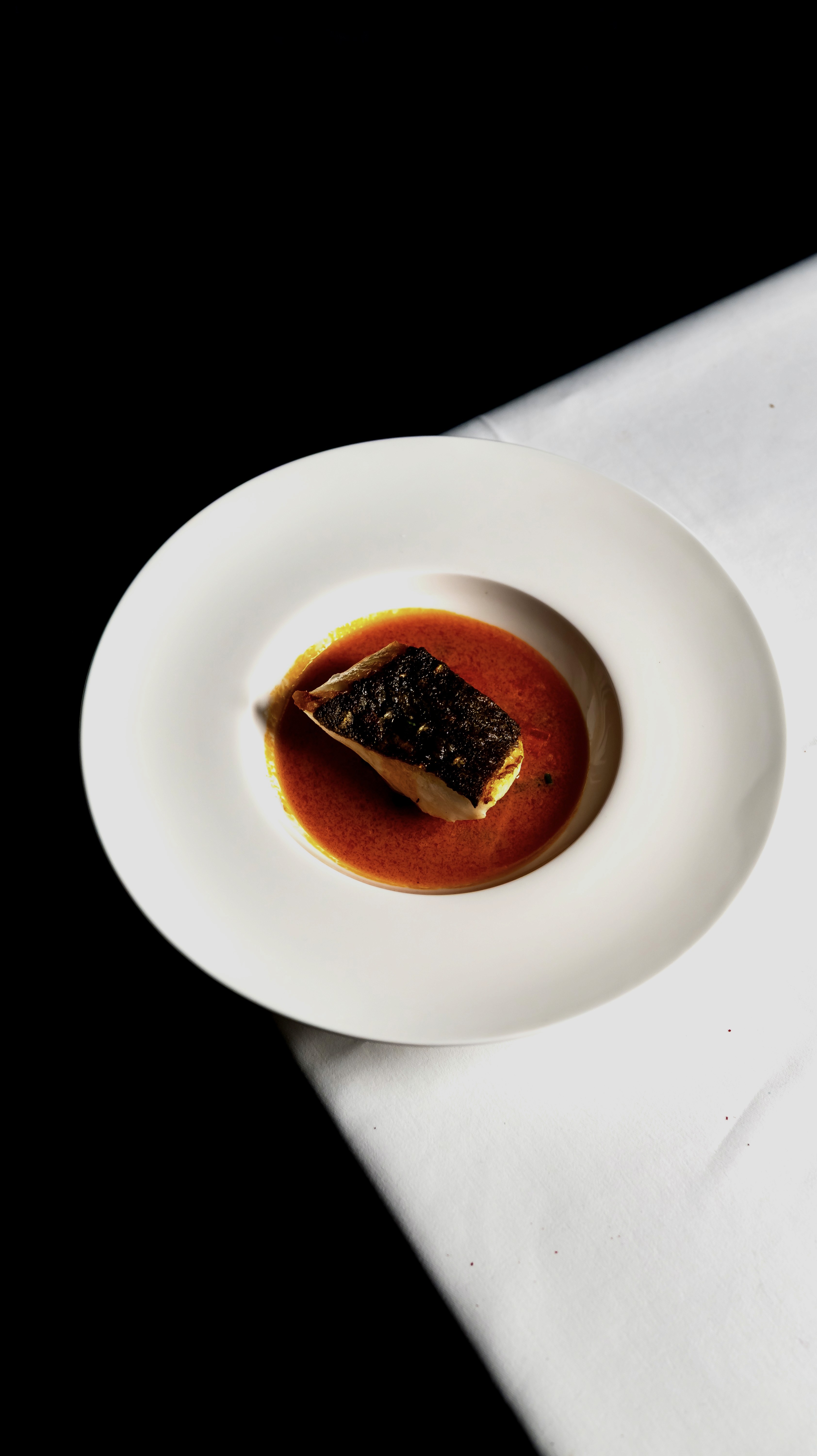 person writing on a piece of paper