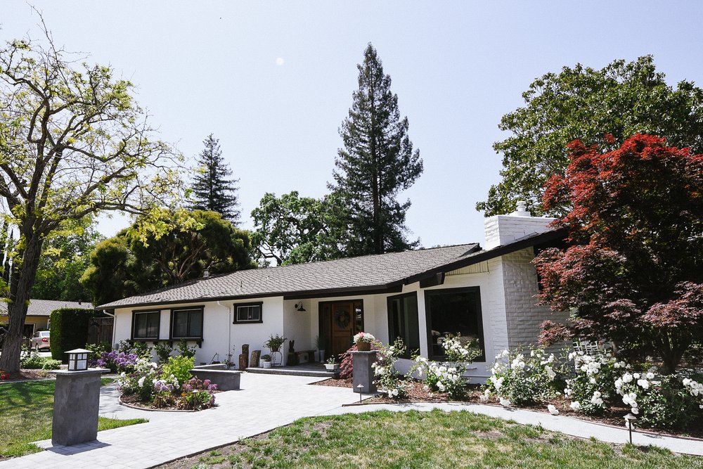 kids lying on a glass land and smiling