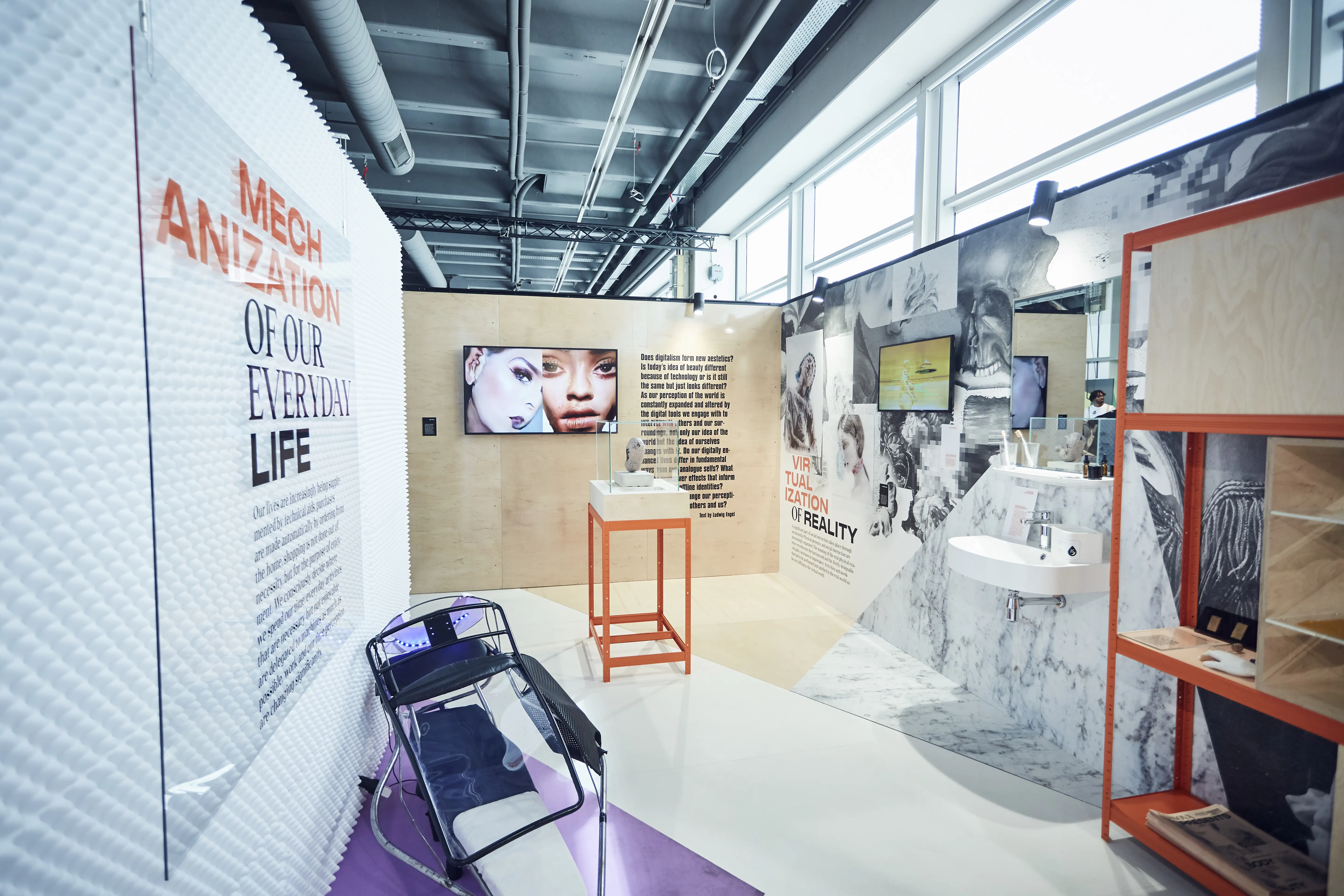 Interior of the Cosnova exhibition at ME Convention with themed walls, screens with beauty imagery and orange shelving.