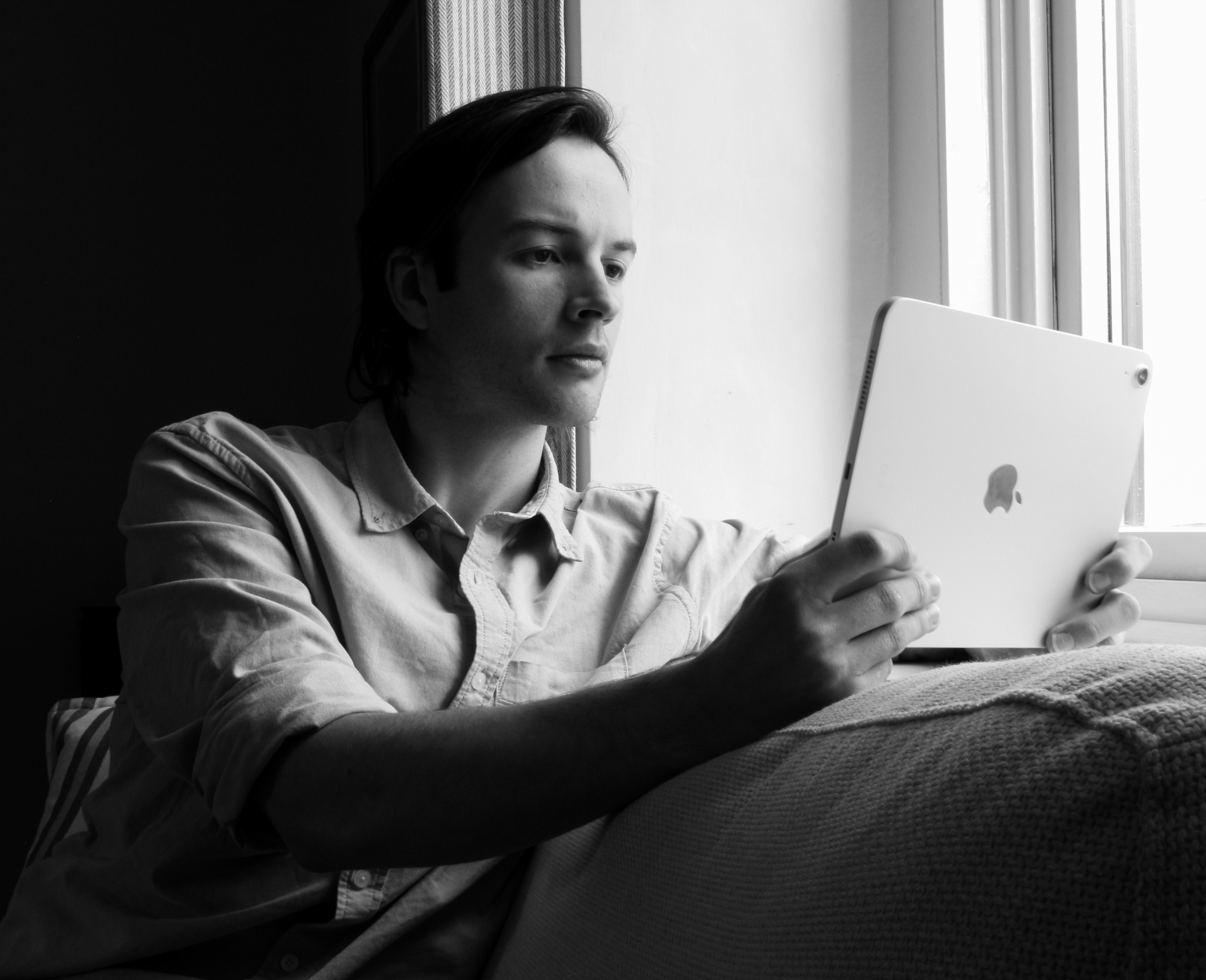Black and white photo of Julian Maguire, Co-Founder and Strategy Director