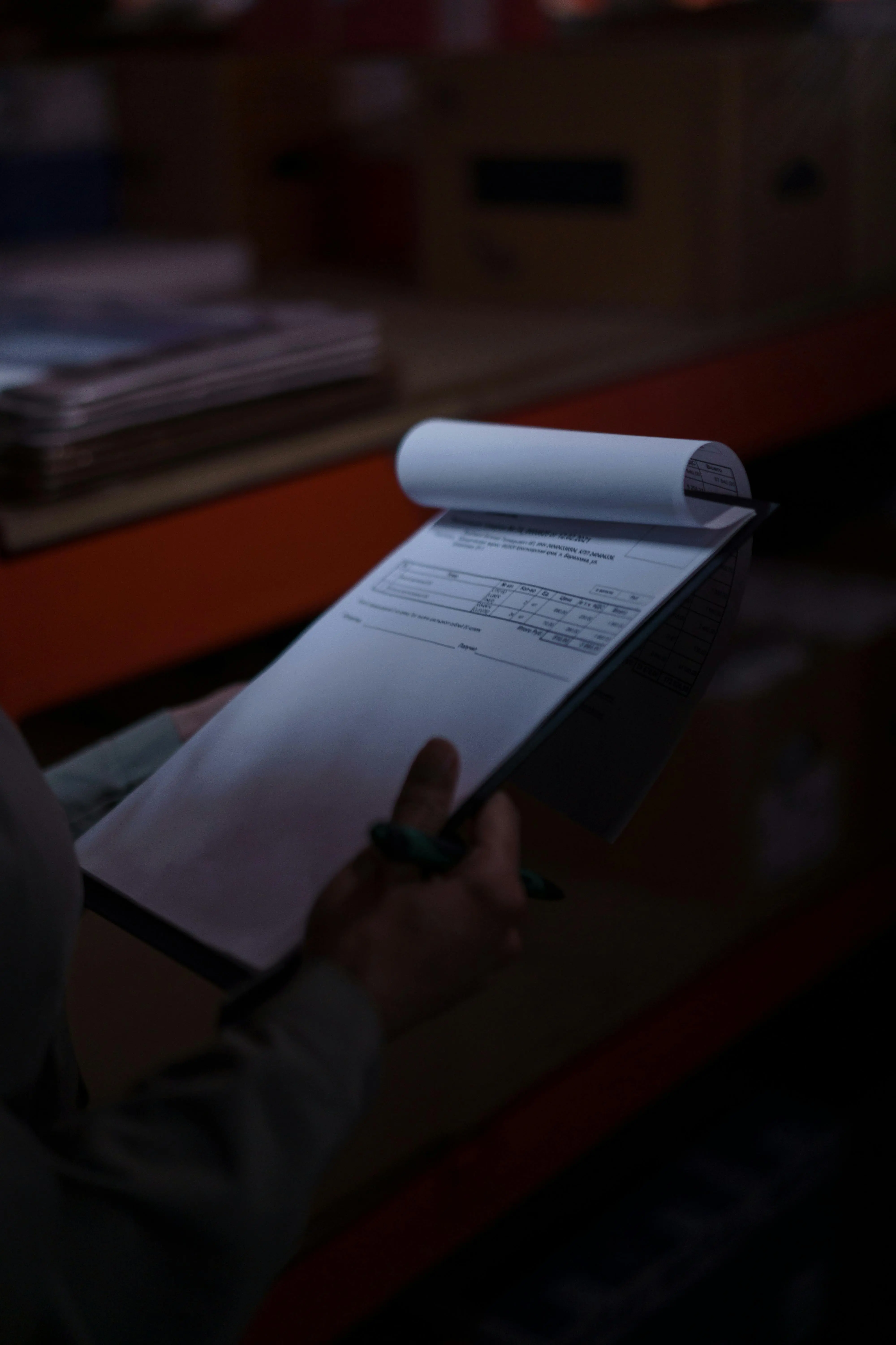 Customs officer reviewing and signing clearance paperwork
