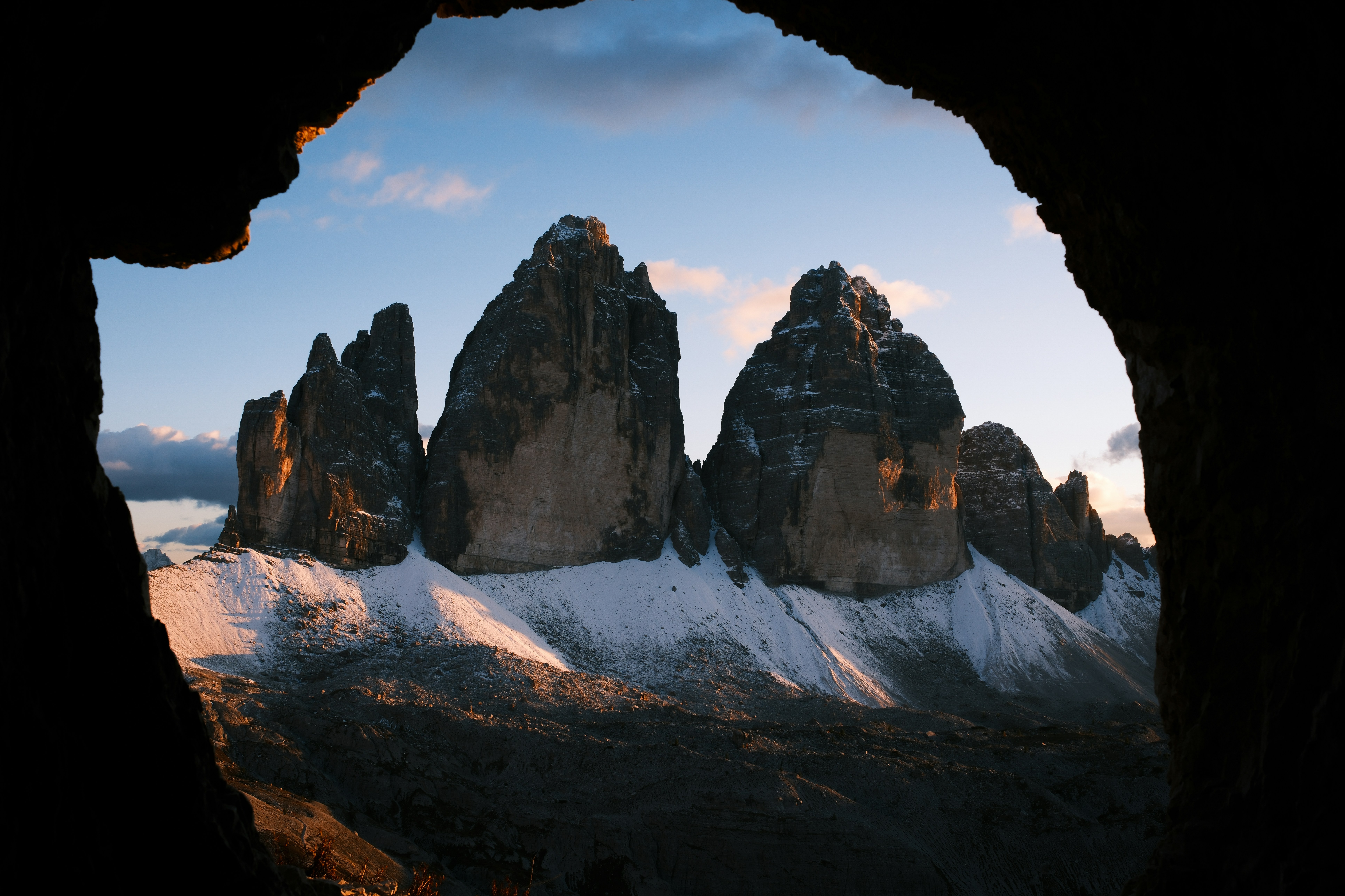 Jagged mountain peaks with snow at sunrise
