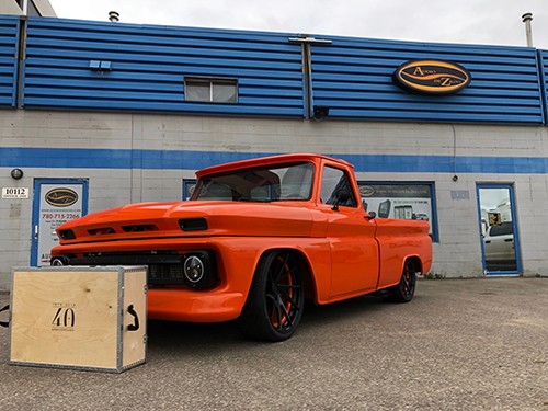 A person stands in a sandstone cave.