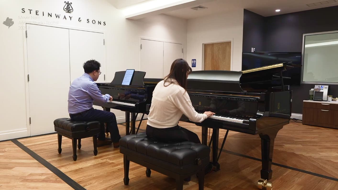 Meyer nam accompanying his student at the mpiano studio 2025 recital.