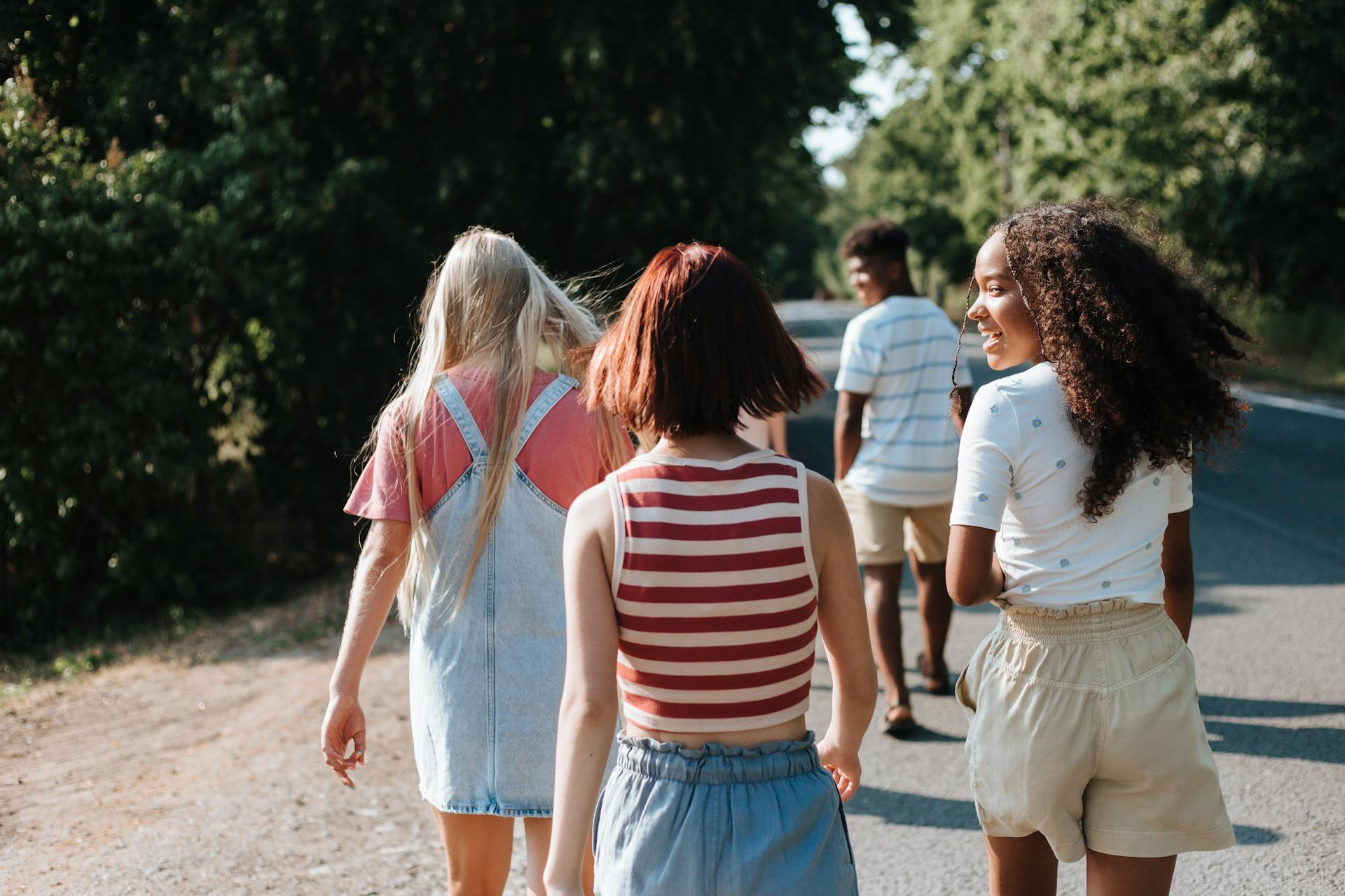 A group of people moving along a highway