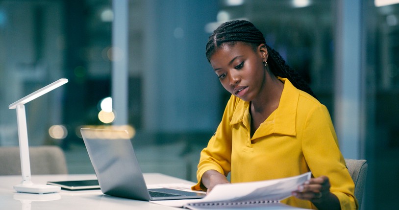 A young woman working late at the office