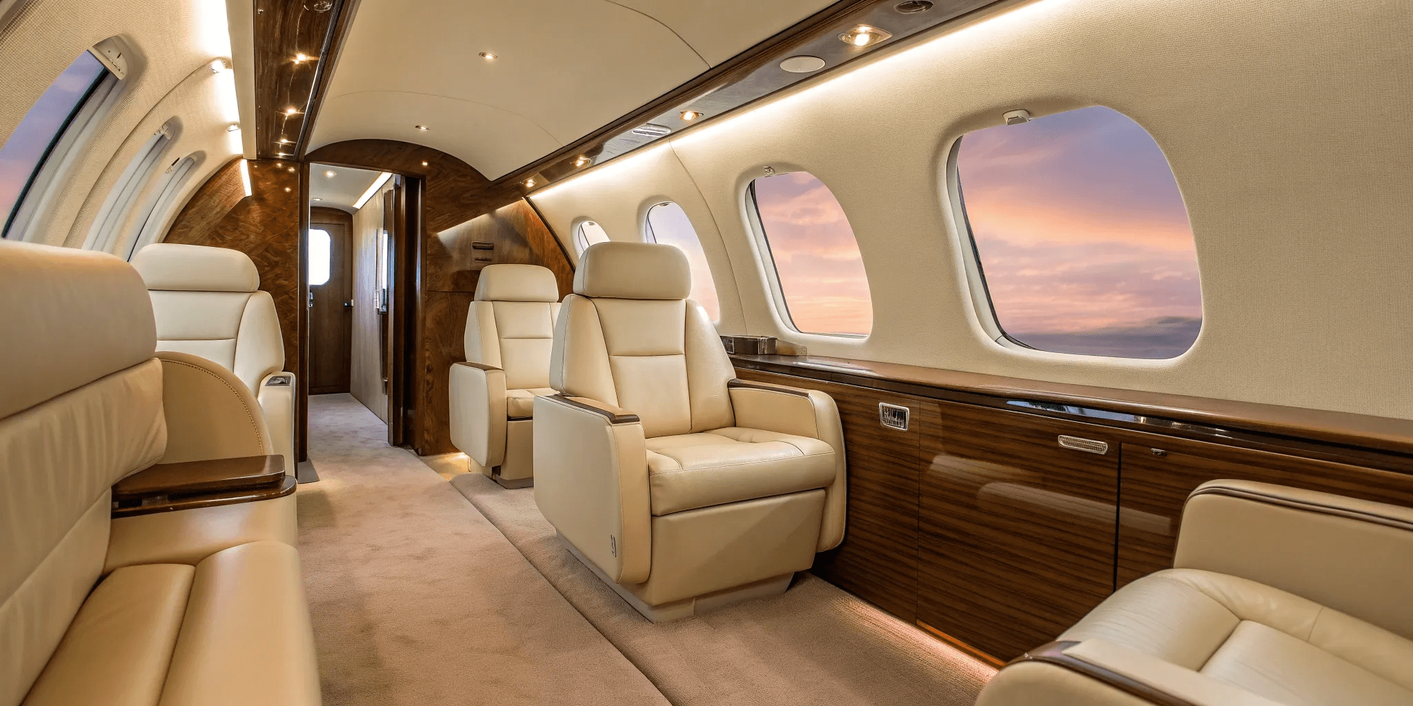 Luxury private jet parked on the runway beside a black executive car, representing premium private aviation and seamless travel service.