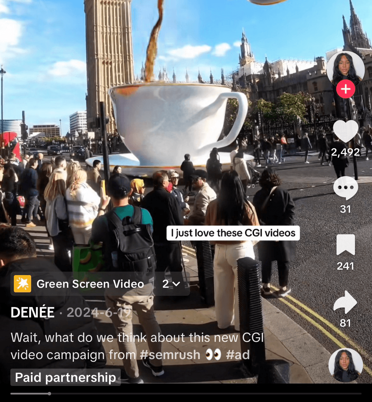A bustling street scene features a giant CGI teacup overflowing with liquid in front of Big Ben. People gather around, looking up. The text reads, “I just love these CGI videos.” Paid partnership block on the left.