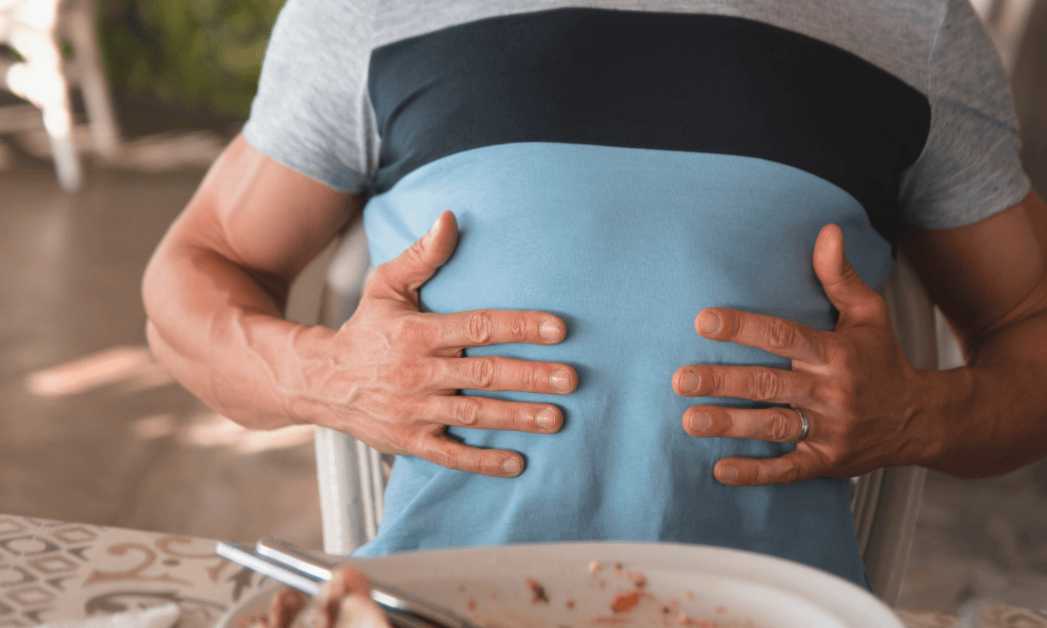 Man holding stomach