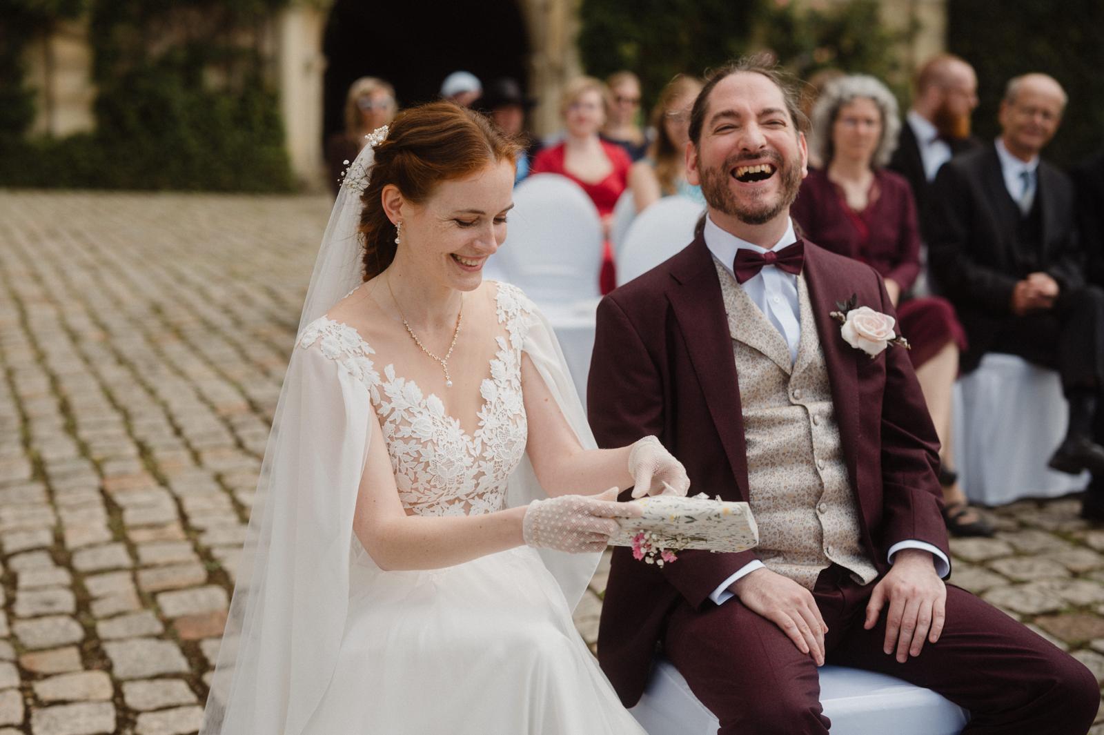 A fast black sports car races down the highway.