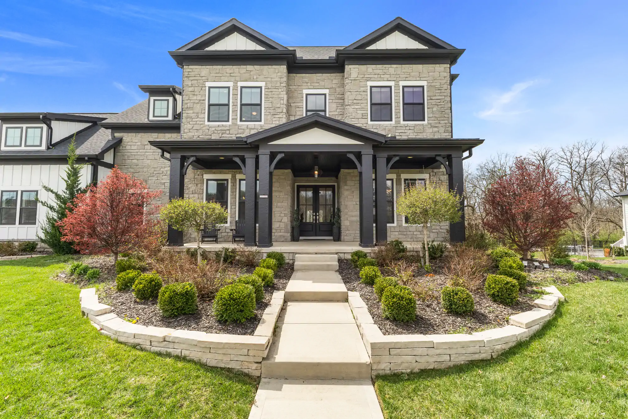 Wide angle shot of a ohio home's front entrance in summer