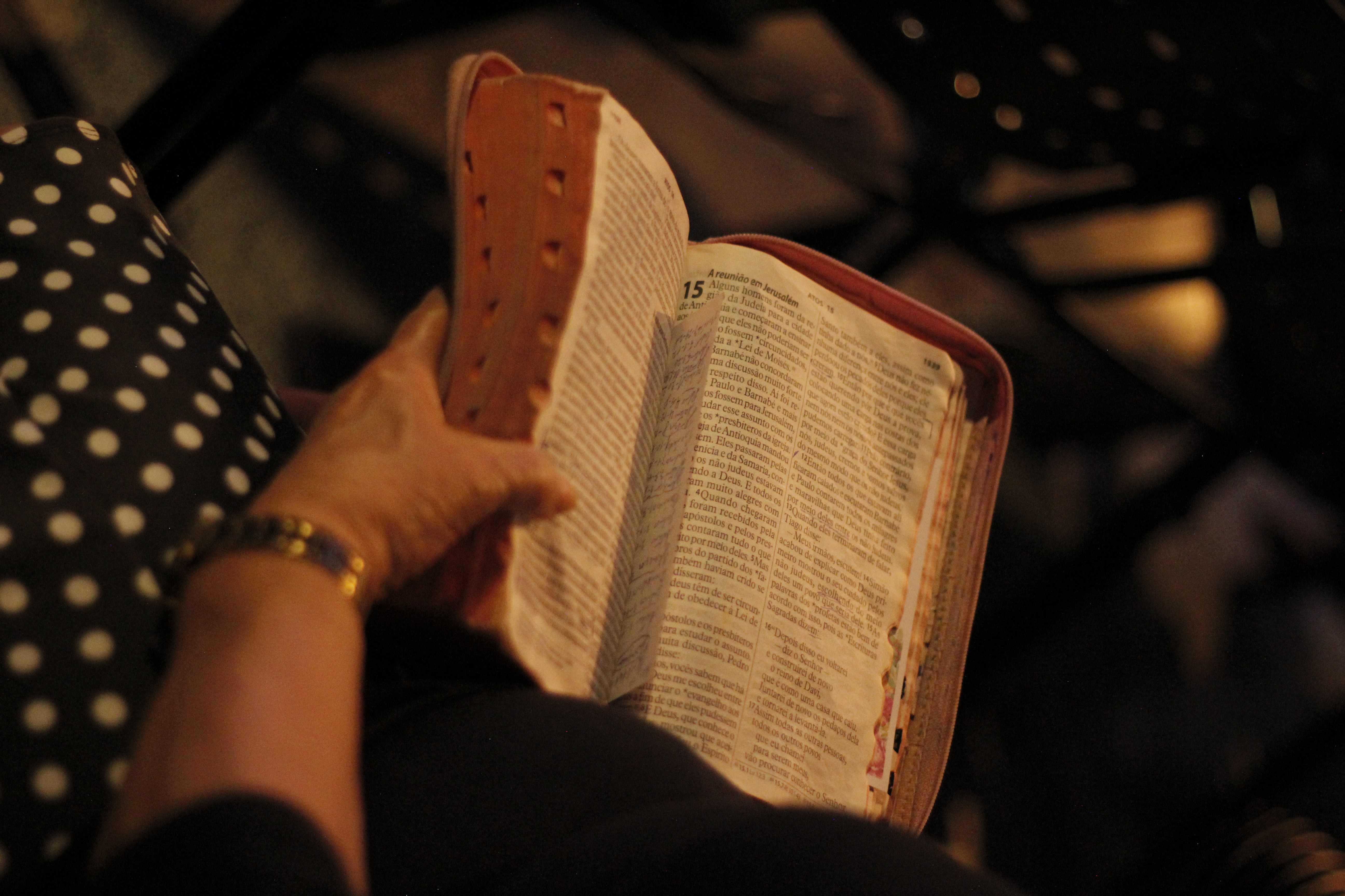 White building with red lighthouse under clear sky.