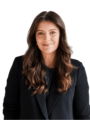 a man in a suit and tie sitting in a chair