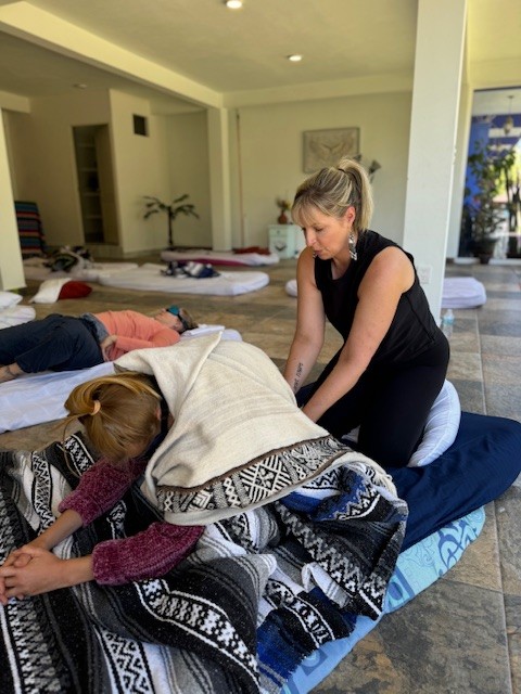 Female yoga instructor teaching a client