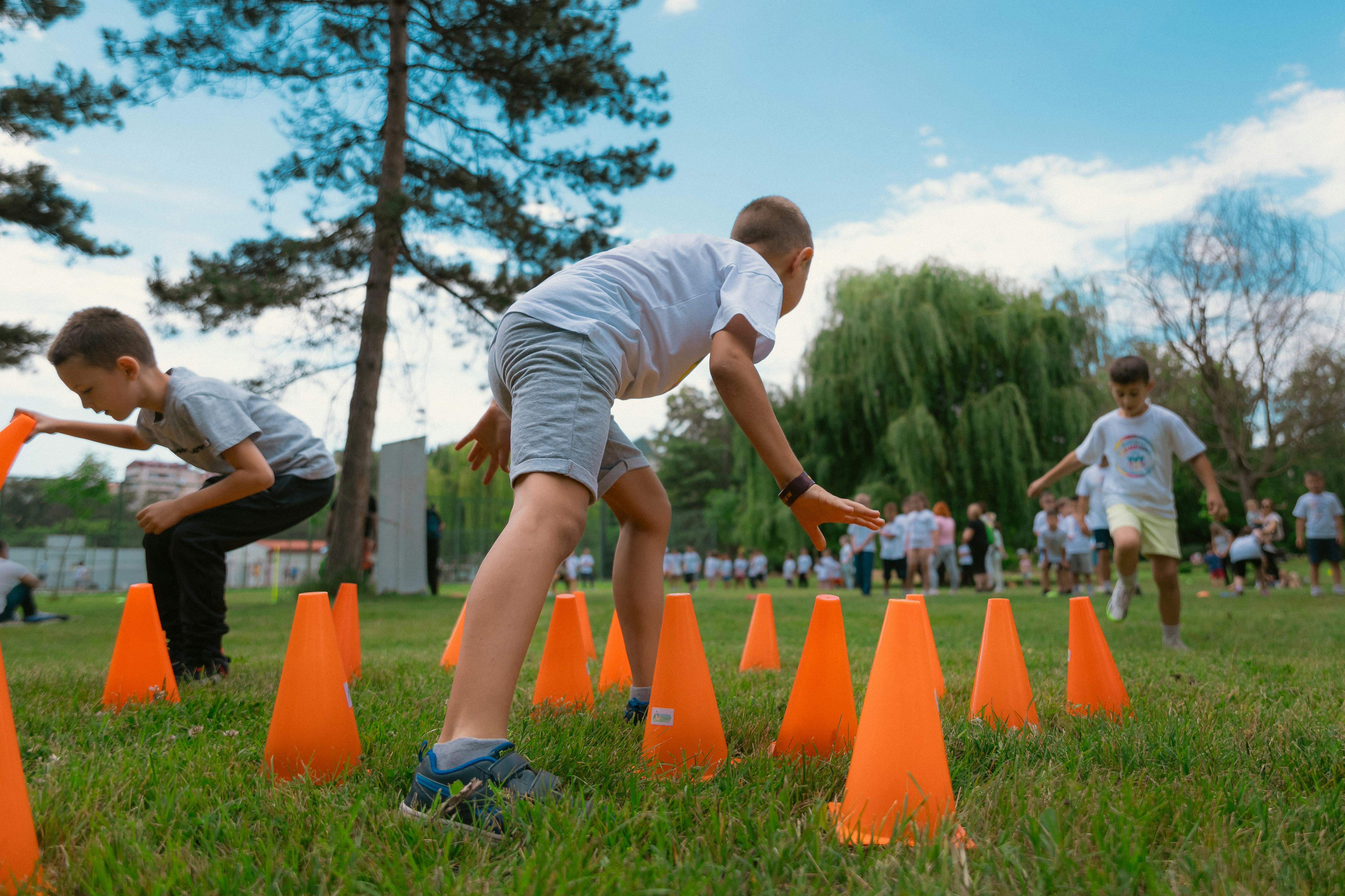 a group of young men playing a game of frisbee