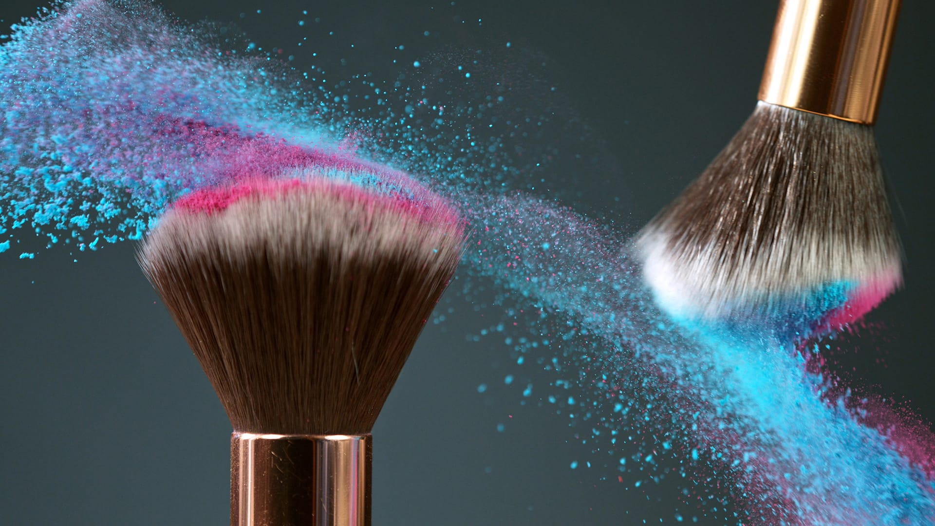 Makeup brushes captured in motion with colorful powder clouds, showcasing dynamic beauty photography and vibrant color textures