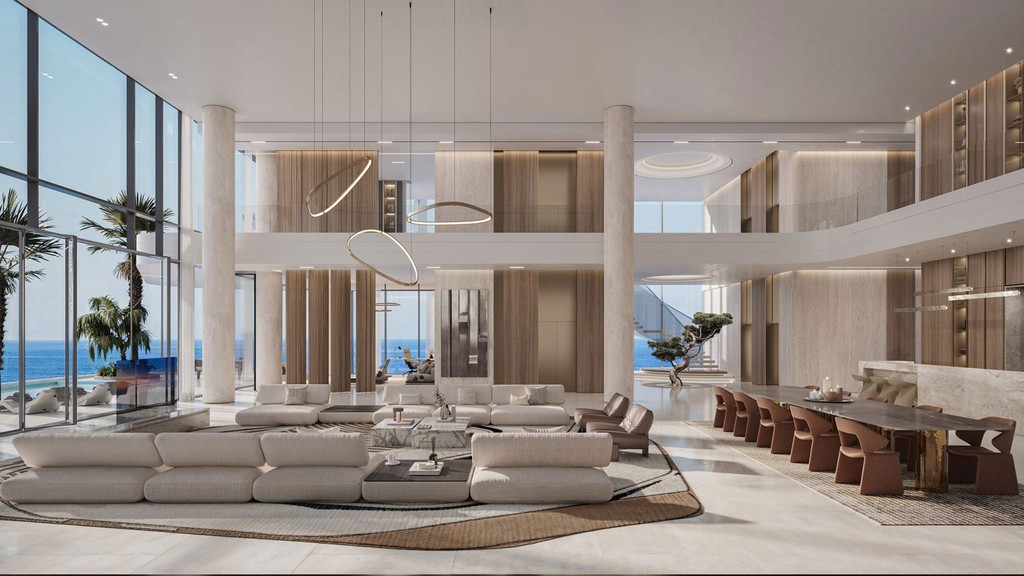 Elegant living room with a panoramic ocean view, designed with modern furnishings at Costa Mare.