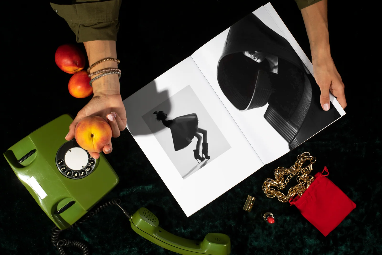 Black and white graphic print arranged with apples and flowers.