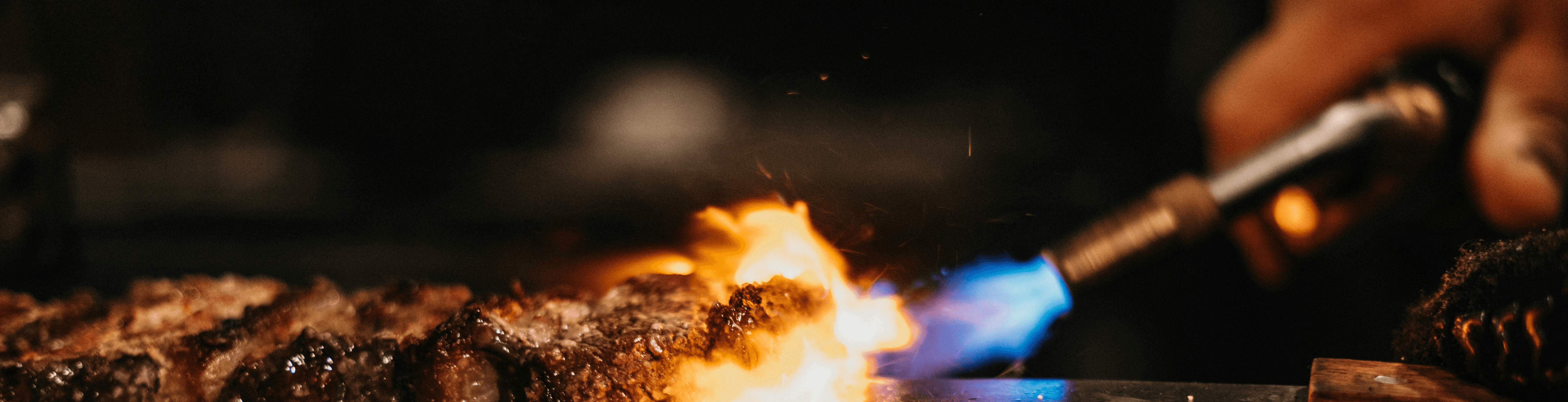 person holding stick with fire