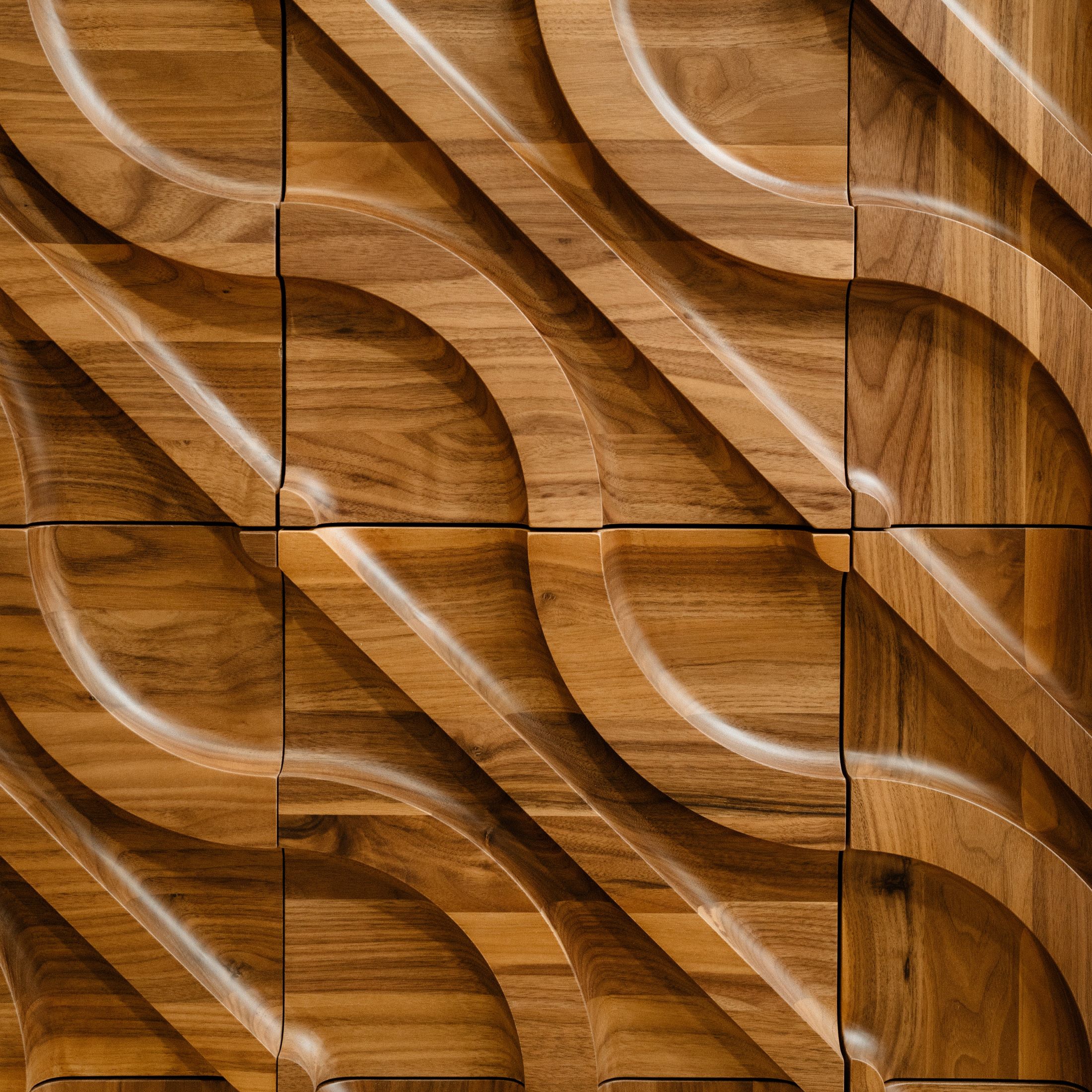 A fast black sports car races down the highway.