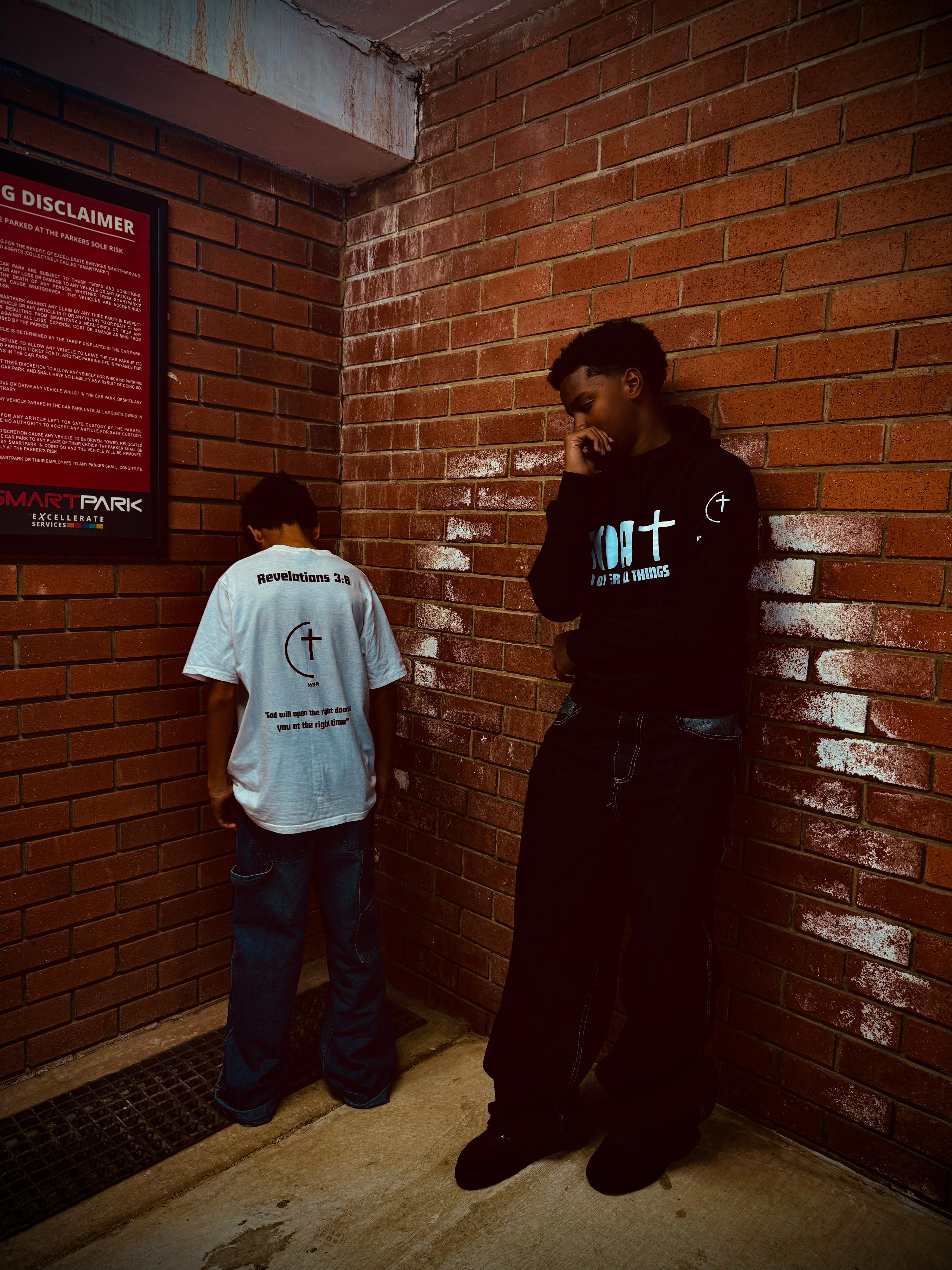 2 people showcasing brand clothes