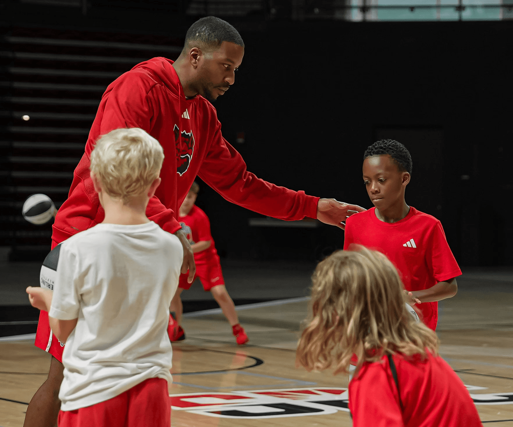 a woman wearing a black coat and a white scarf