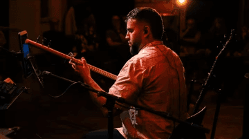 Surreal portrait of man with kaleidoscope effect and neon lighting