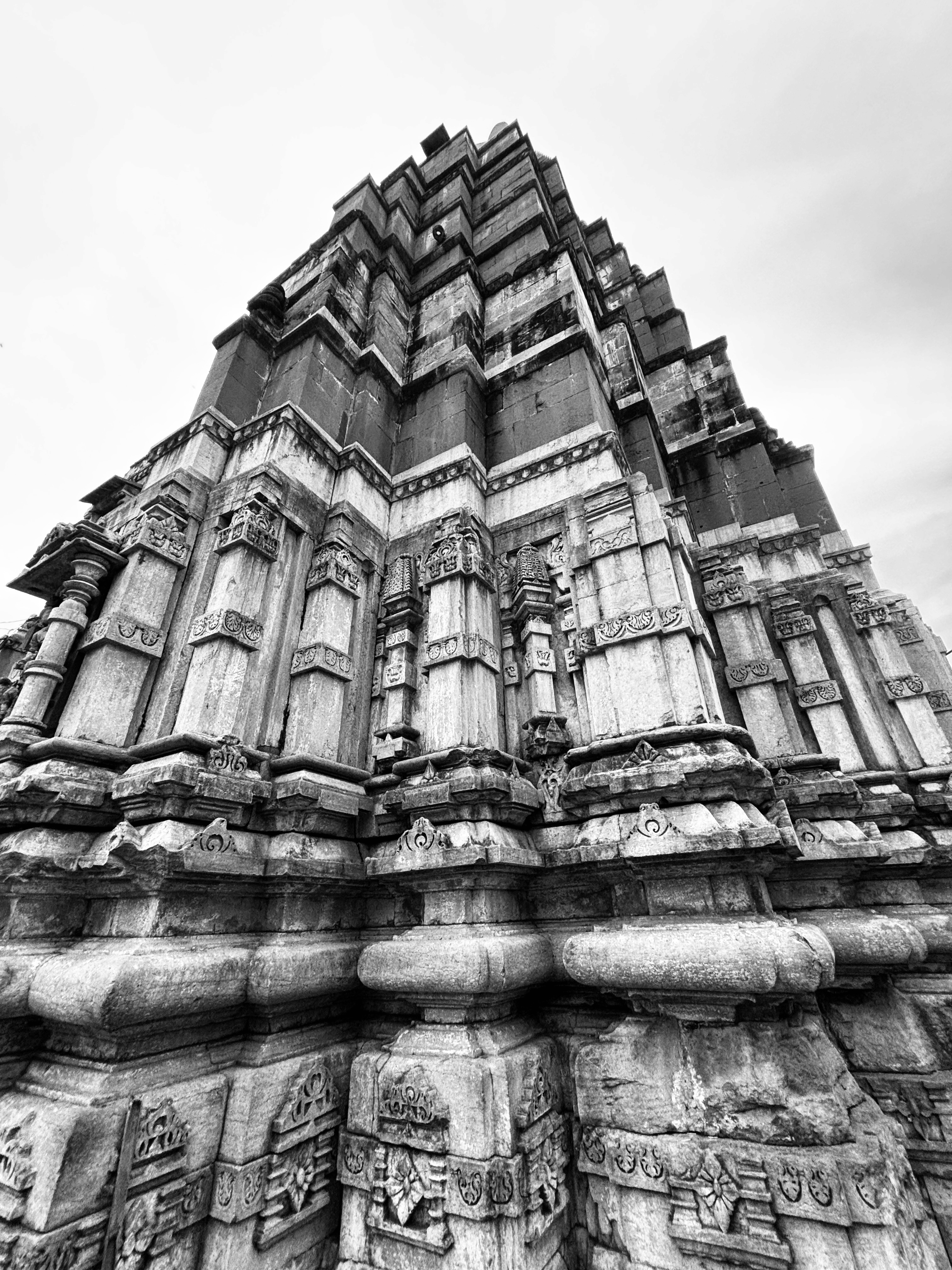 a group of people standing on top of a sandy beach