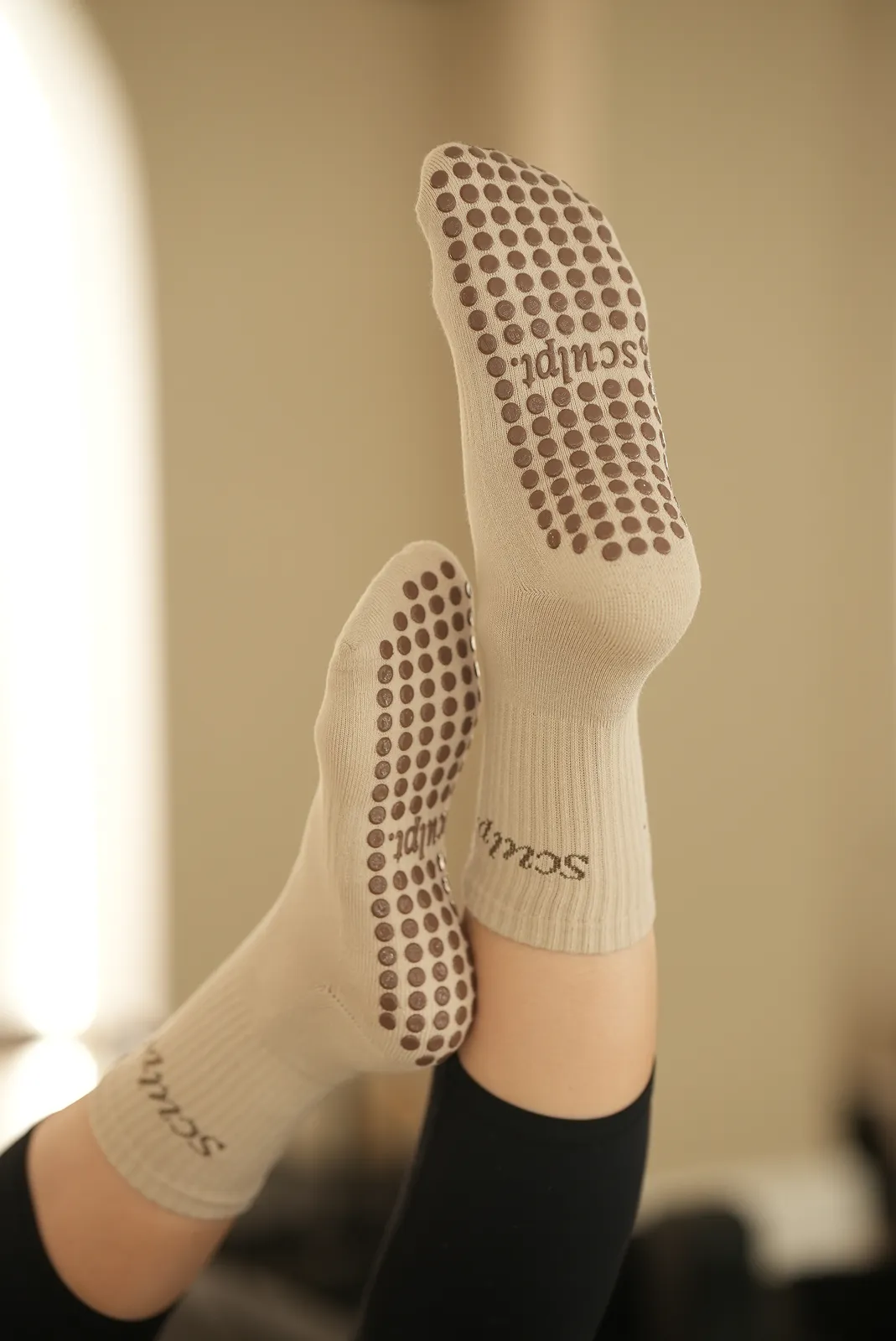 Sculpt branded Reformer Pilates grip socks with non-slip dots on soles