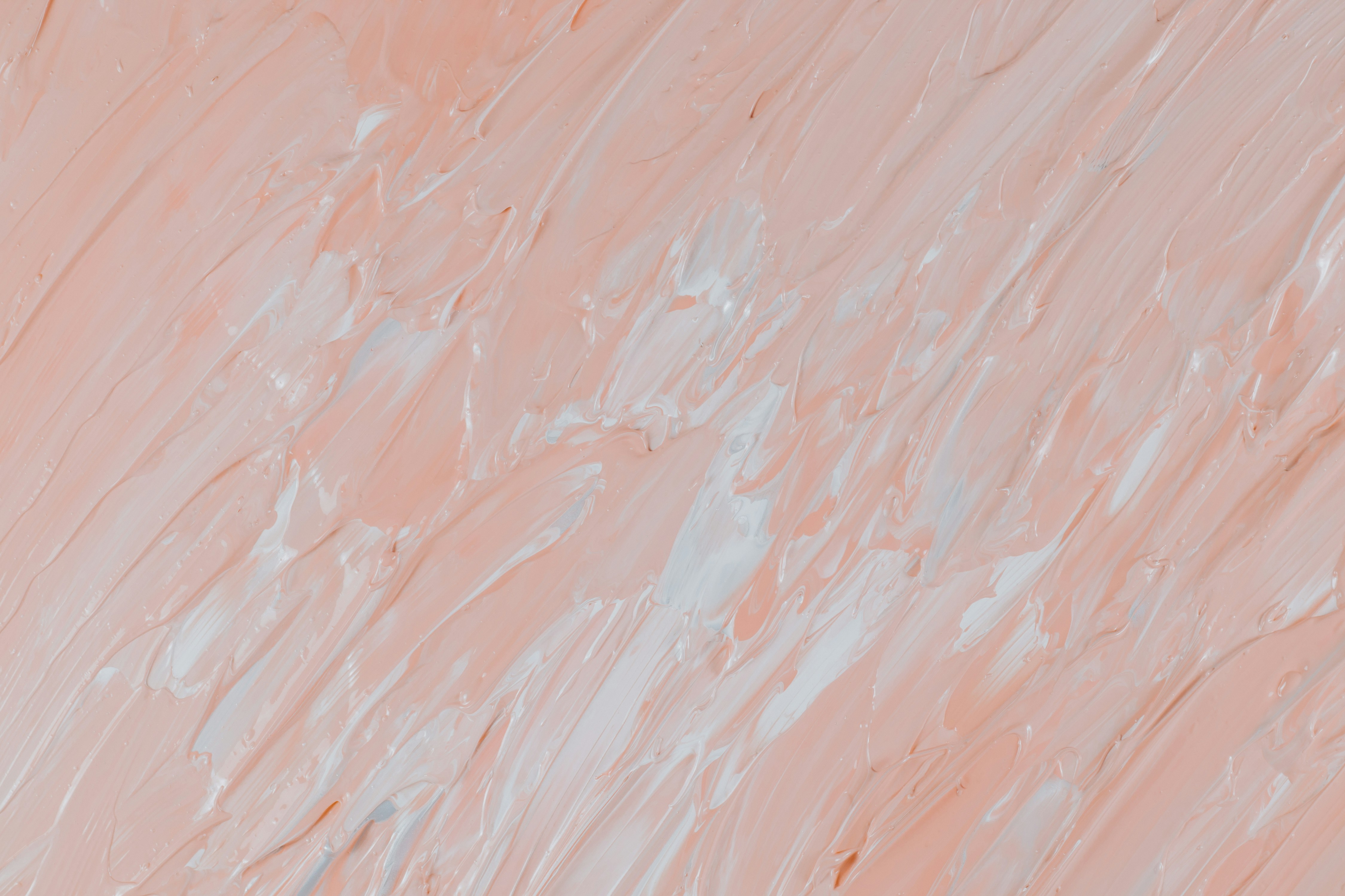 Layered pink paint strokes with visible brush texture