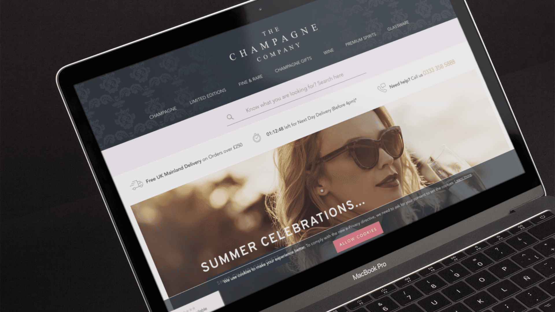 The Champagne Company website on laptop