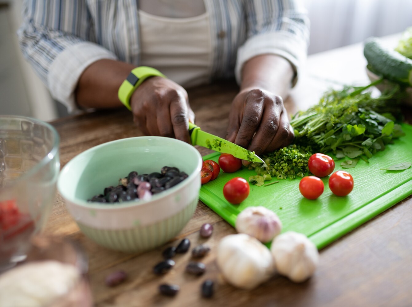 person cooking a healthy meal for maintenance after taking weight loss drugs