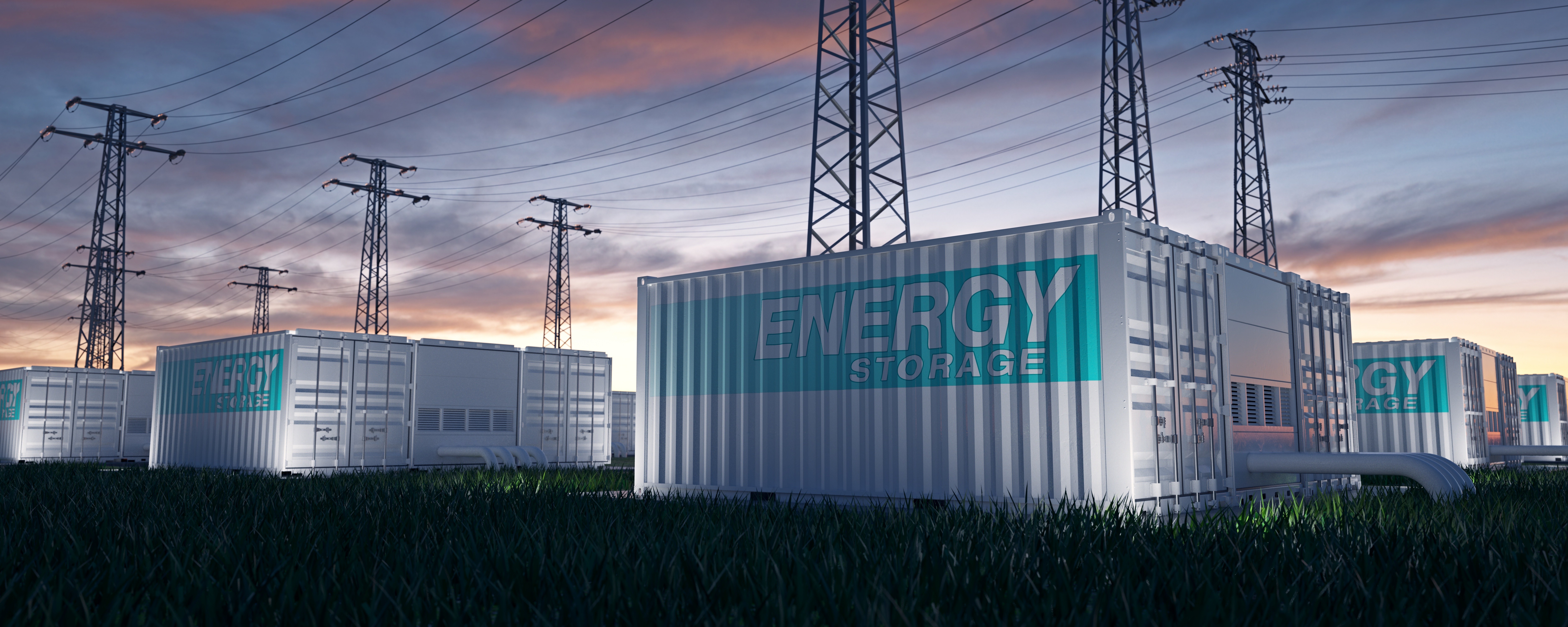 A commercial energy storage system, with transmission towers in the background