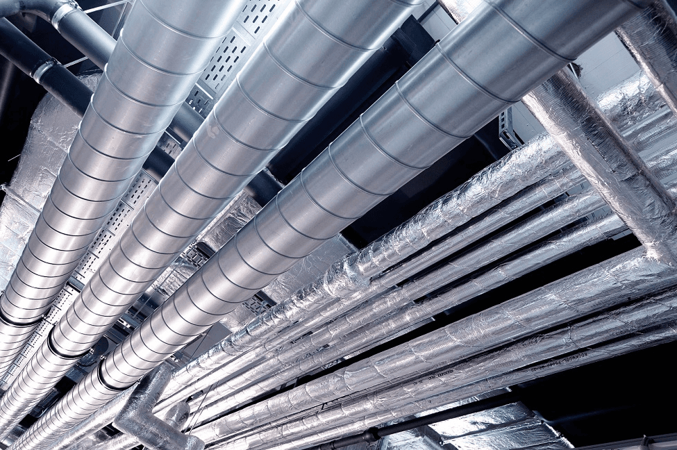 woman sitting around table holding tablet