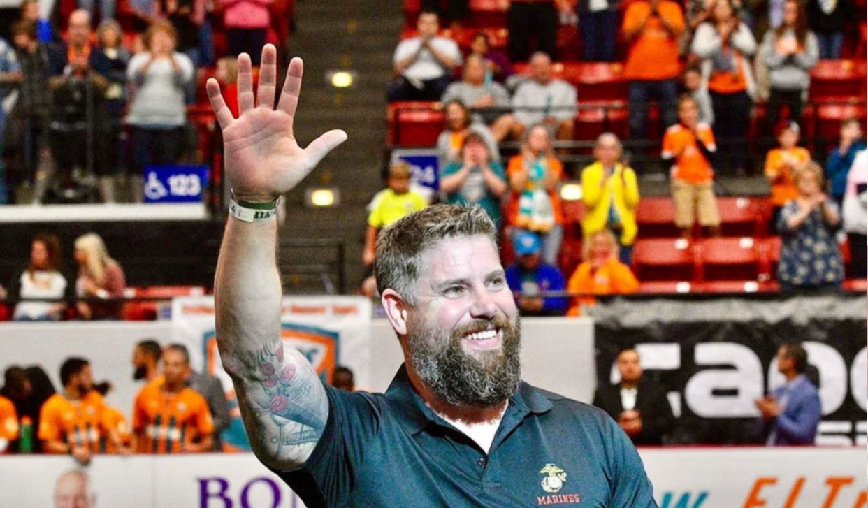 Fighter jet ascending with afterburners engaged