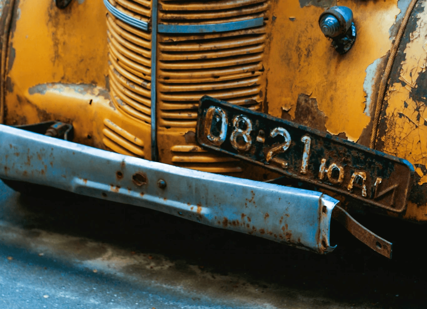 yellow car with white and black license plate