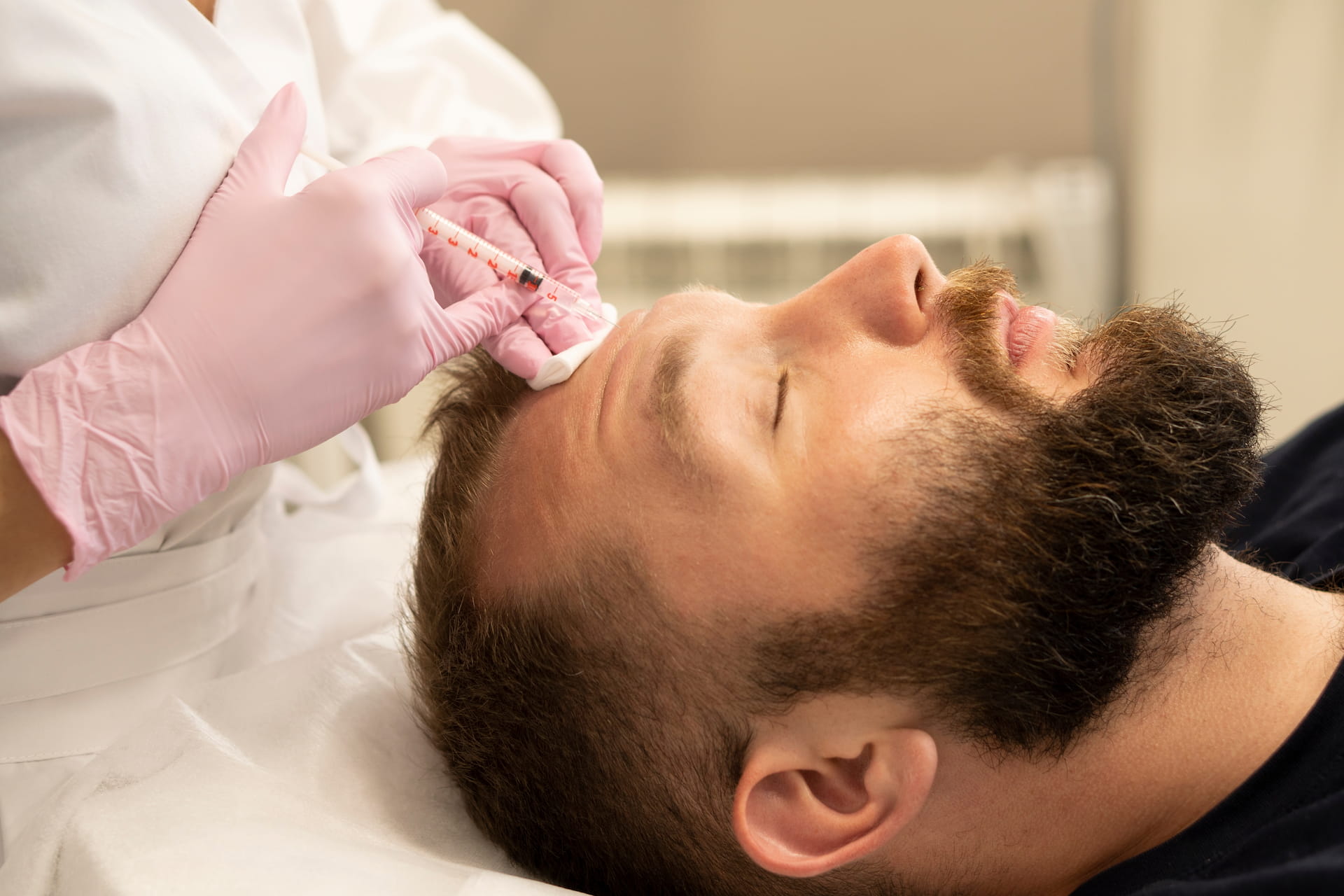 Male patient receiving a Botox injection near the jaw - men's neurotoxin treatment at Avinity Health near Gainey Ranch, Scottsdale.
