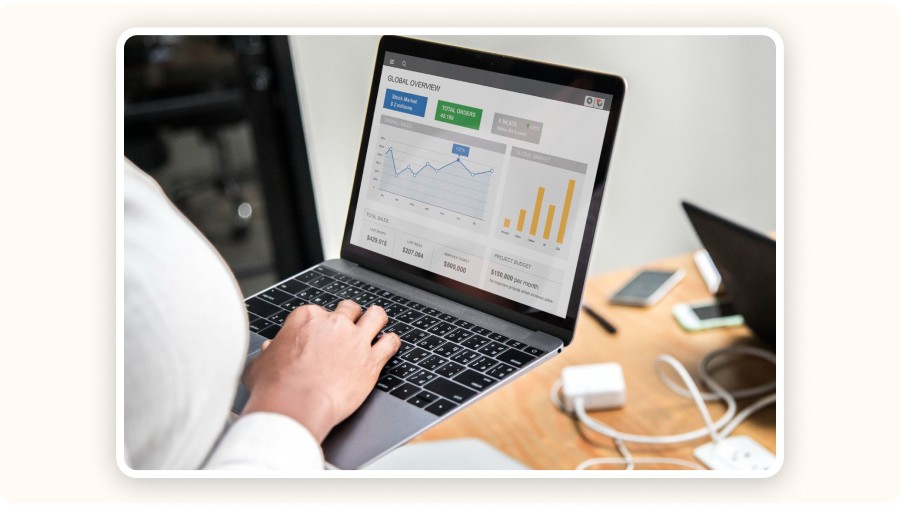 Person analyzing business dashboard on laptop with charts and sales data&nbsp;