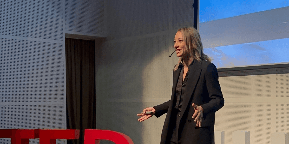 Dr. Irina Zelenkova delivering a TEDx talk on high performance, showcasing her expertise in hypoxia and human limits