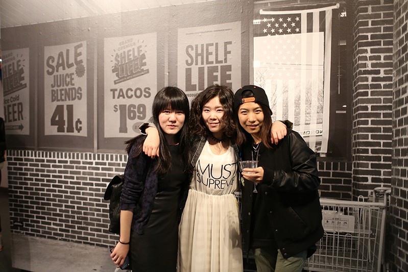 three students smiling