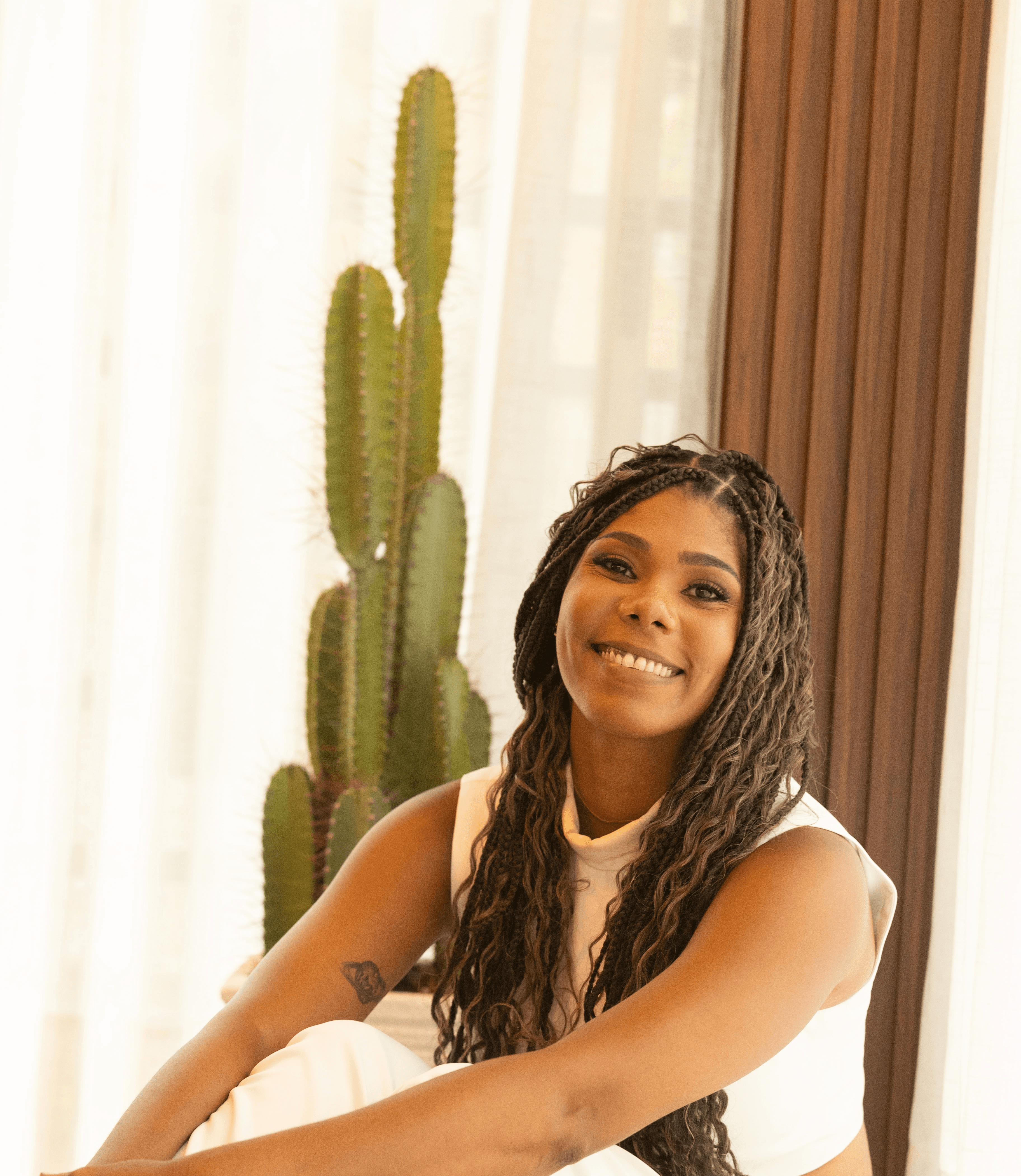 Smiling Asian man in a gray t-shirt against a neutral background, exuding a friendly and approachable vibe.