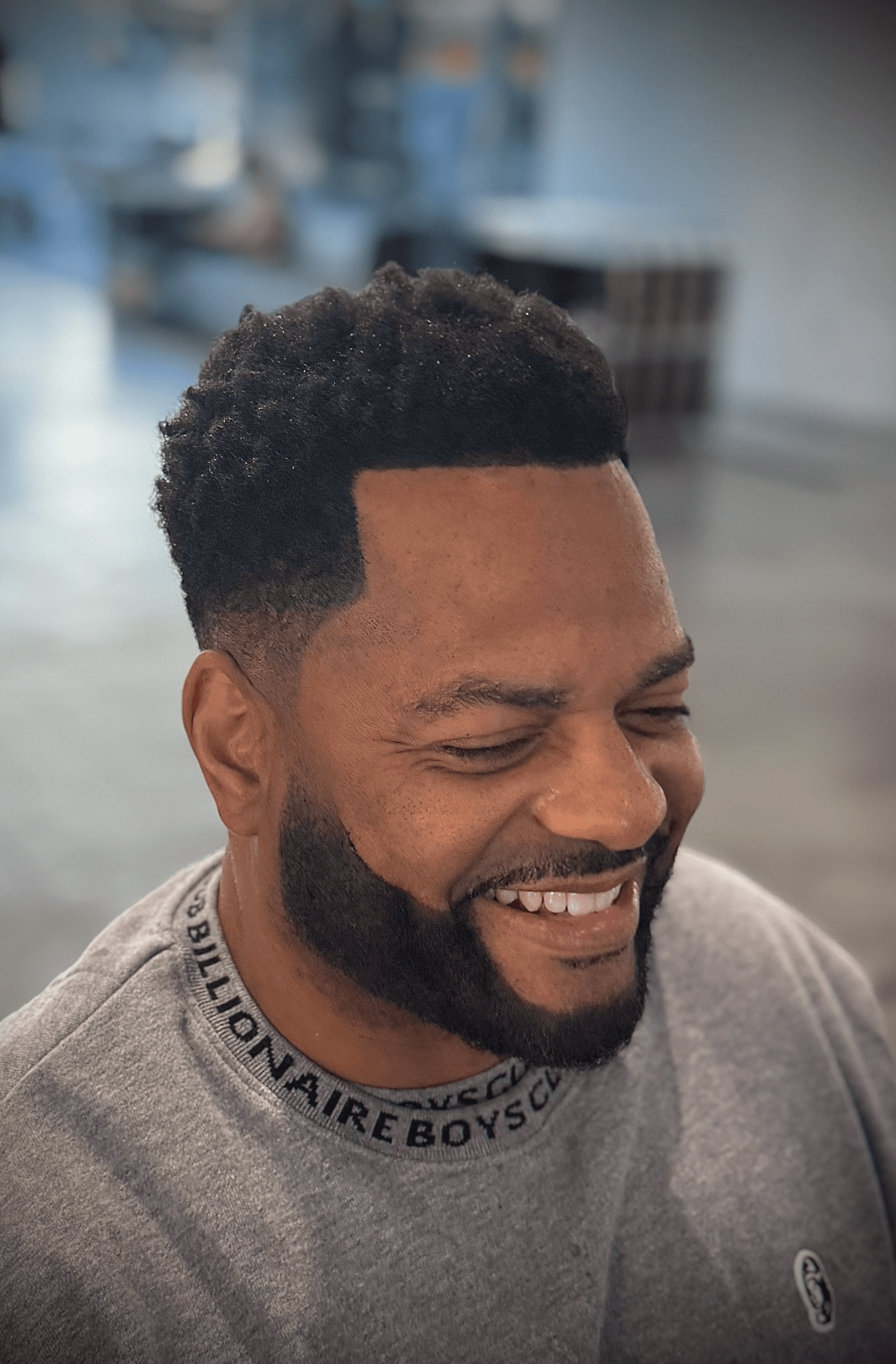 Microfiber hairline enhancement with a clean taper fade, perfect for African American hairstyles by Courtney Palmore.