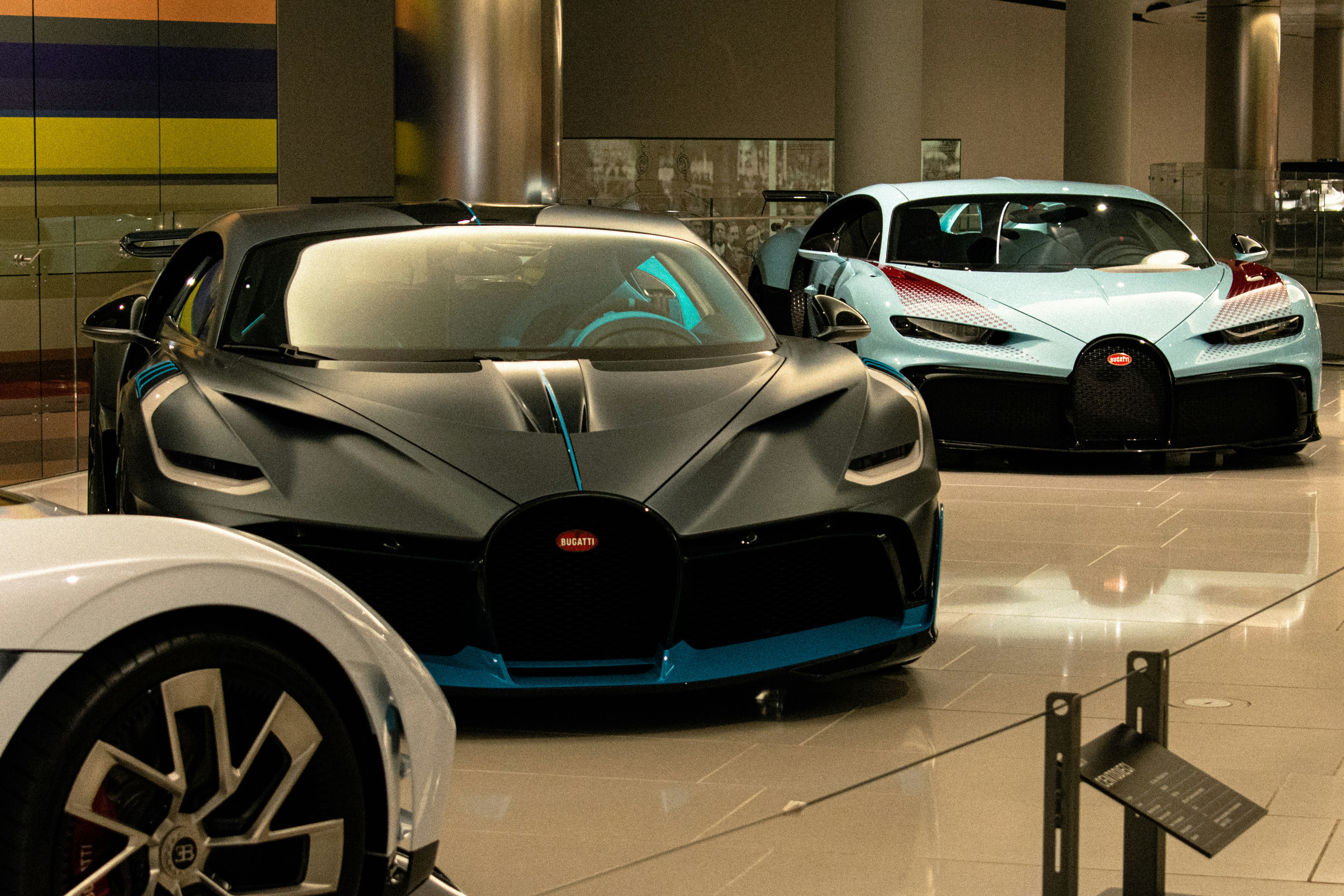 a group of cars that are sitting in a room