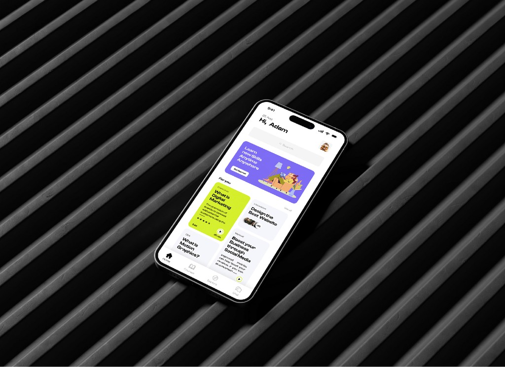 A smartphone displaying a modern, colorful app interface with various icons and text rests on a sleek, ribbed black surface, emphasizing technology and mobile application design.