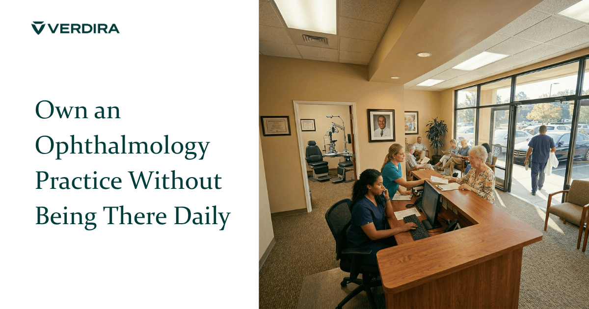 Ophthalmology practice running smoothly with staff at front desk helping patients while physician owner walks out the door with his white coat over his arm and his framed portrait on the wall