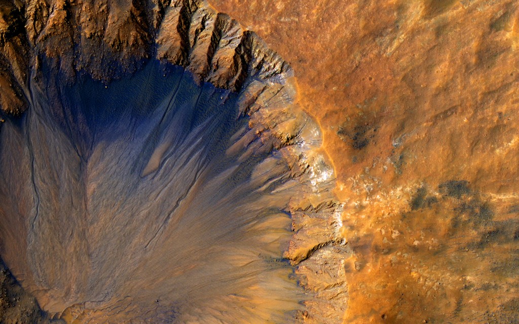 Abstract image of a crater in sand