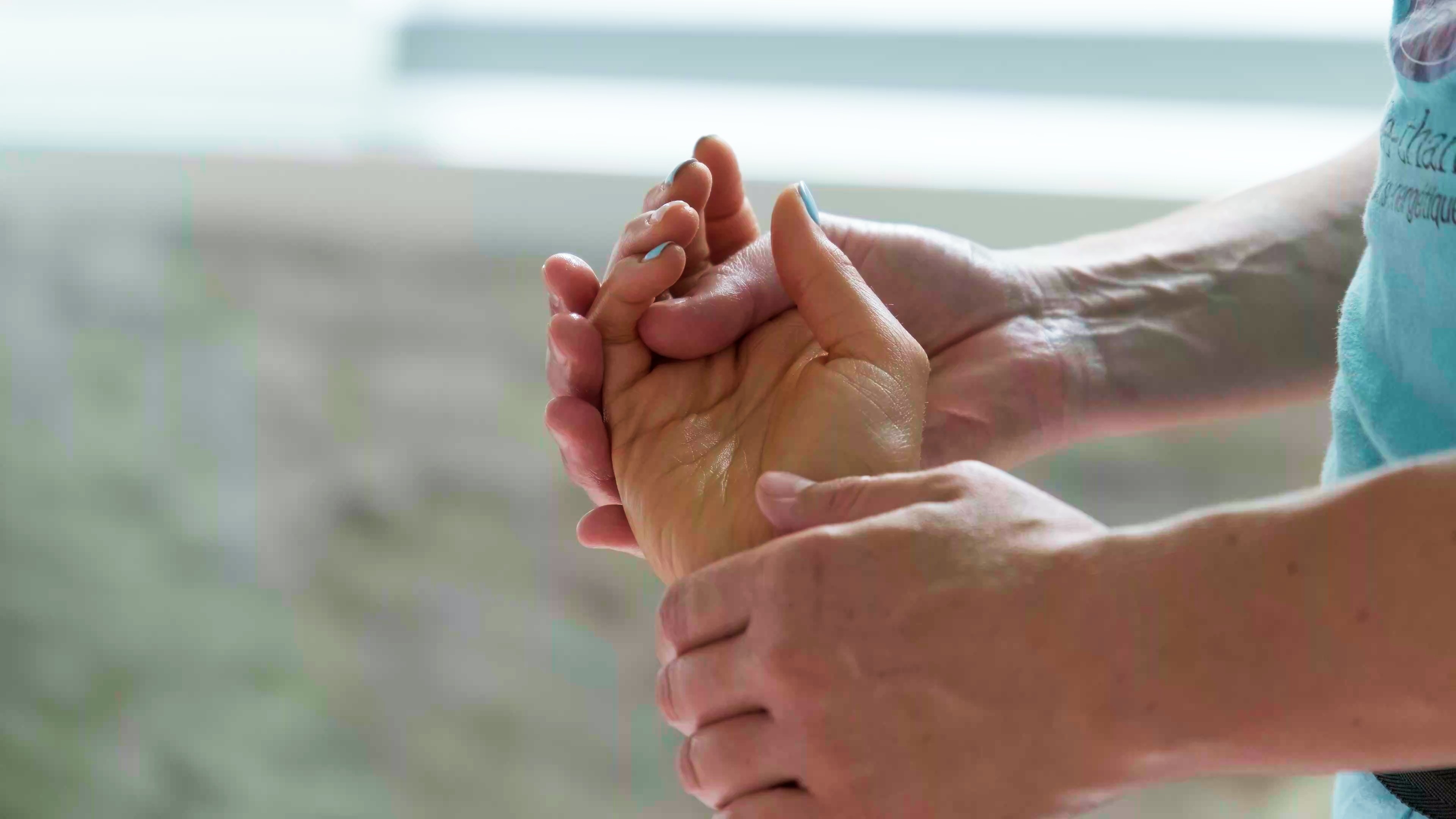 Modern living room with red sofa and grey chairs.