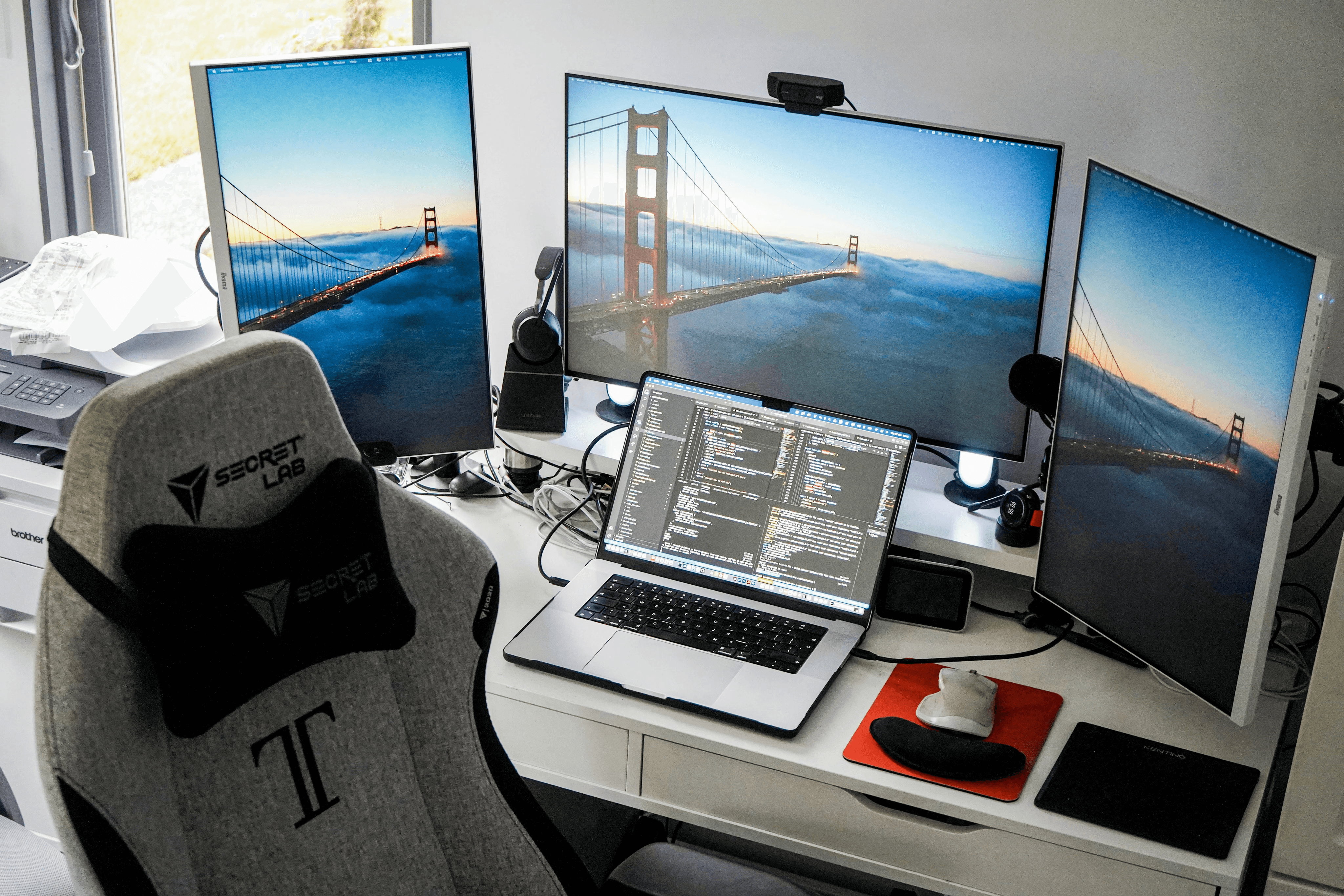 Multi-monitor desk setup used for testing screen mirroring apps