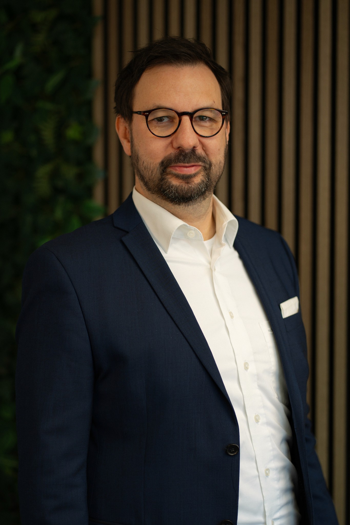 A machine cutting a piece of metal with sparks