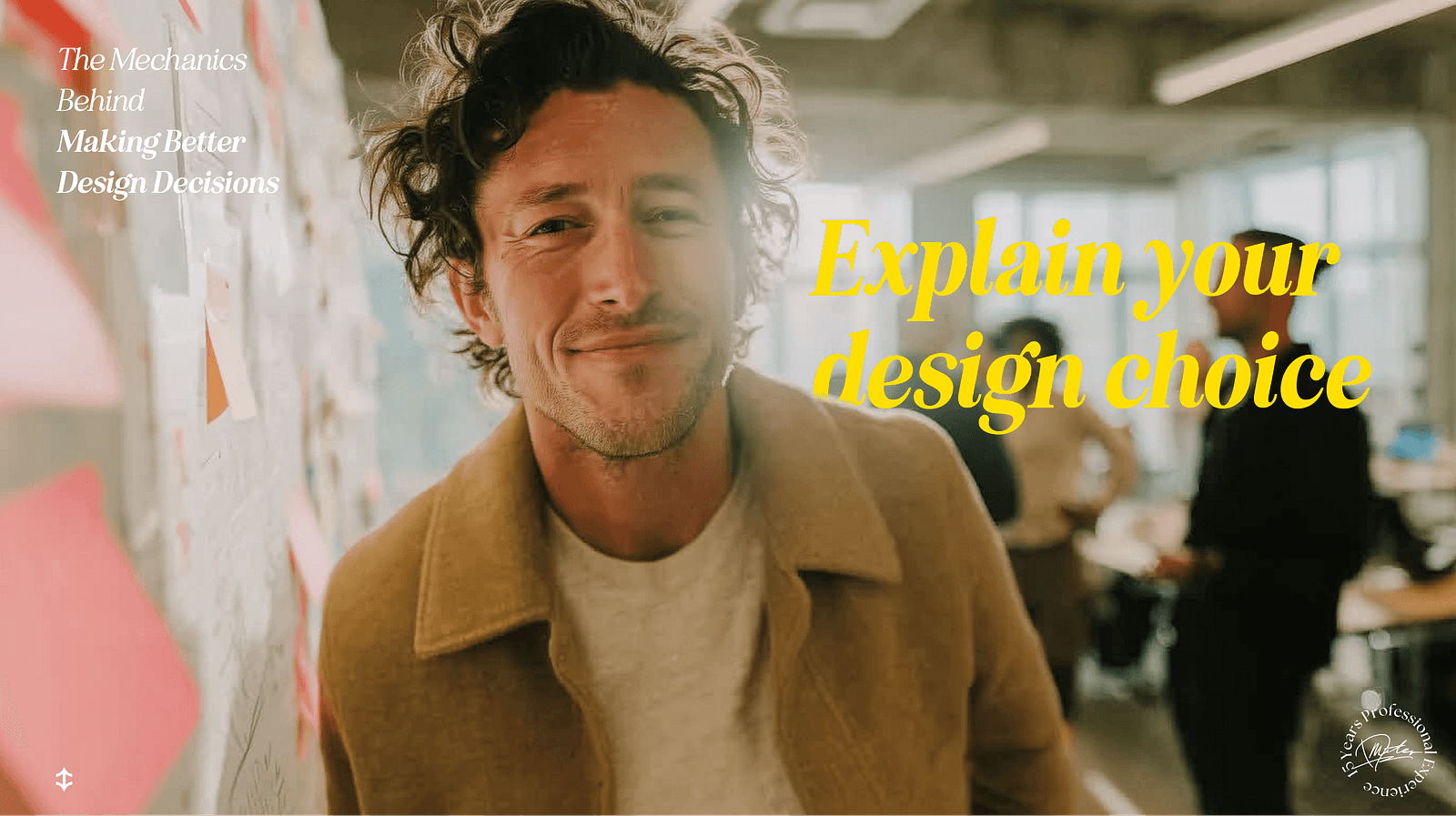 A smiling male designer stands confidently in front of a wall covered with sticky notes in a creative office environment. Large yellow text reads “Explain your design choice,” emphasizing the importance of communicating design rationale. The blurred background shows teammates in discussion, reinforcing a collaborative design process.